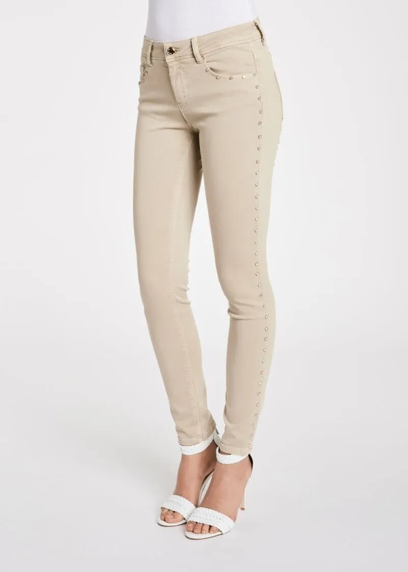 Pantaloni skinny con borchie
